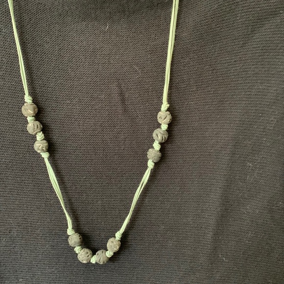 Necklace, carved beads, light green cord, 29.5”.  Looks great against black. - Picture 2 of 3